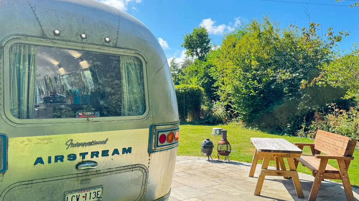 Close-up of the Airstream’s badge on its polished aluminium nose