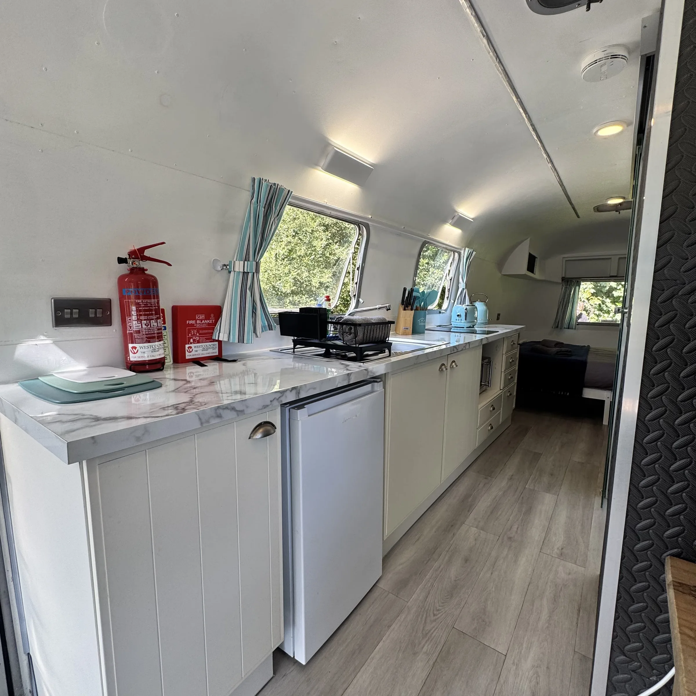 Looking the length of the Airstream’s interior, from the kitchen through to the seating area