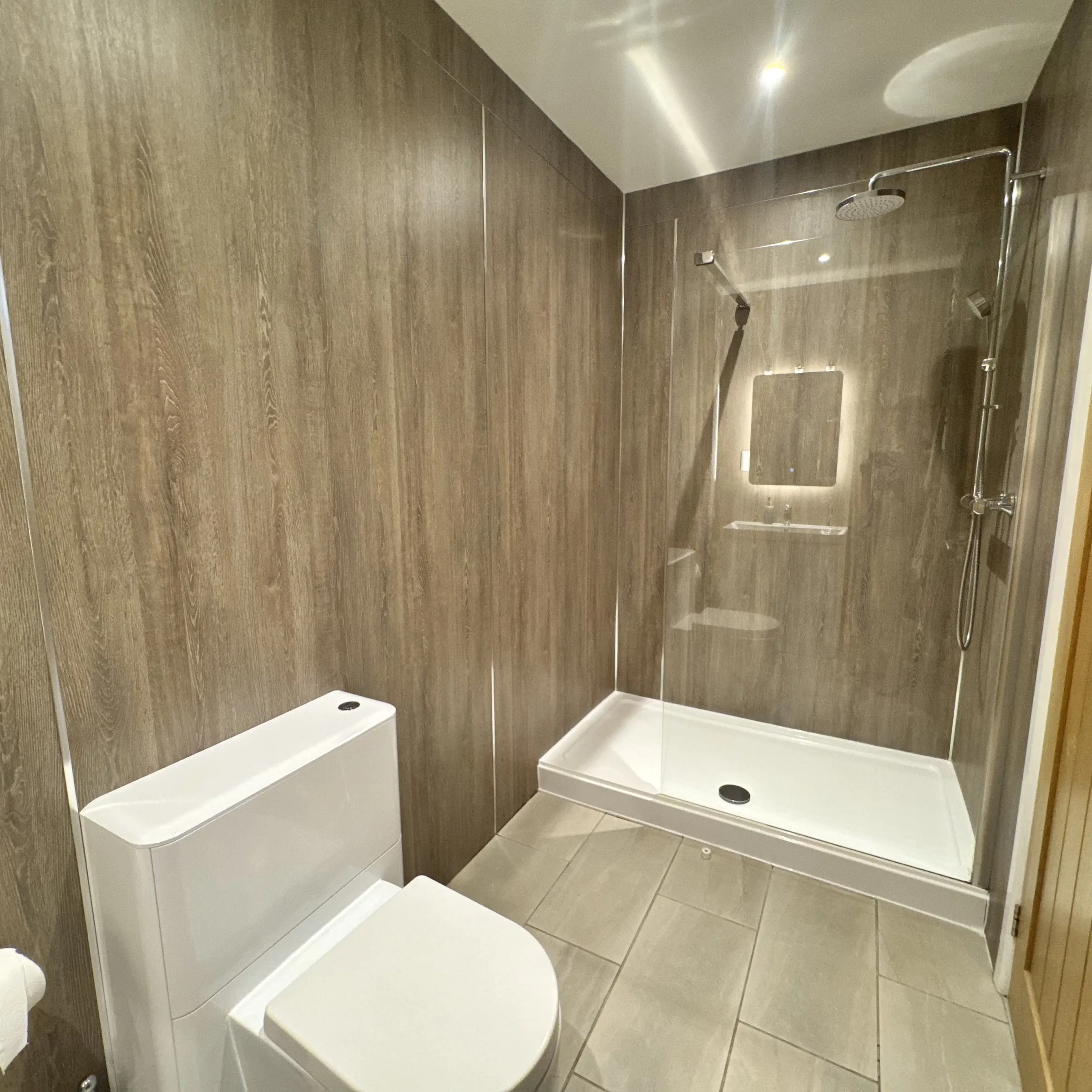 The walk-in shower at Helyk, with a rainfall head over a full tray