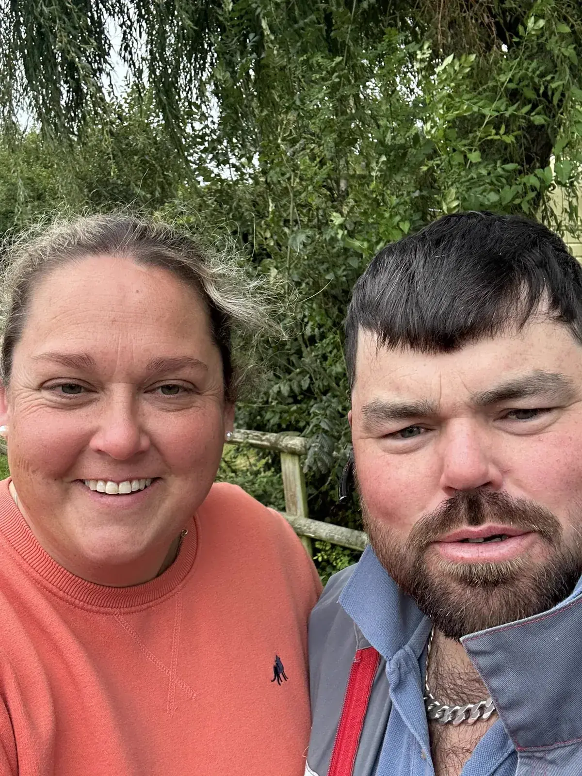 Becky and John Gough, who run Willow Valley, photographed outdoors with willow branches behind them